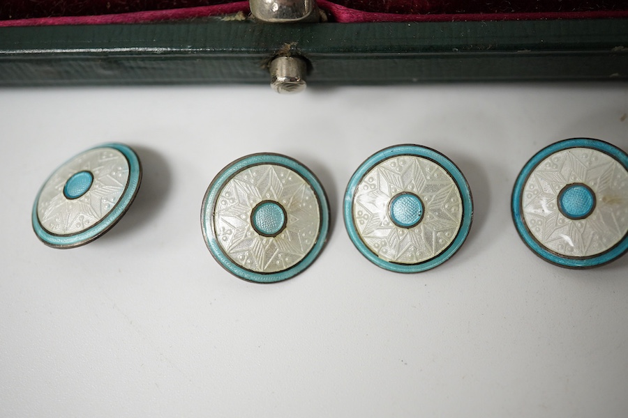 An Edwardian set of 6 blue and white enamelled buttons, marked Sterling, 10mm and a cased set of 5 (ex 6) green and white enamelled buttons, unmarked, 20mm. Condition - good